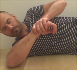 Dr. Gorczynski demonstrating posterior capsule stretch/sleeper stretch
