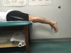 Dr. Gorczynski demonstrates prone hang technique to treat knee flexion contracture